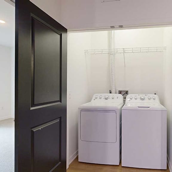 Thumbnail 28 of 28 a laundry closet with side-by-side full sized washer and dryer