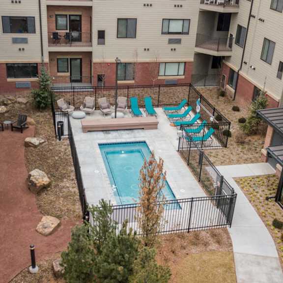 the conrad courtyard with park, cocktail pool and spa, grills and walking path in omaha ne