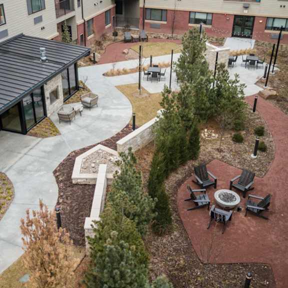 courtyard park with fire pit at the conrad in omaha ne