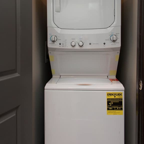 Thumbnail 6 of 7 Stacked washer and dryer in a closet