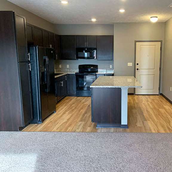 Thumbnail 6 of 21 Spacious kitchen with a large island with light granite counter tops  of 1 bedroom apartment for rent at The Flats at 84 best   apartments Lincoln NE 68516