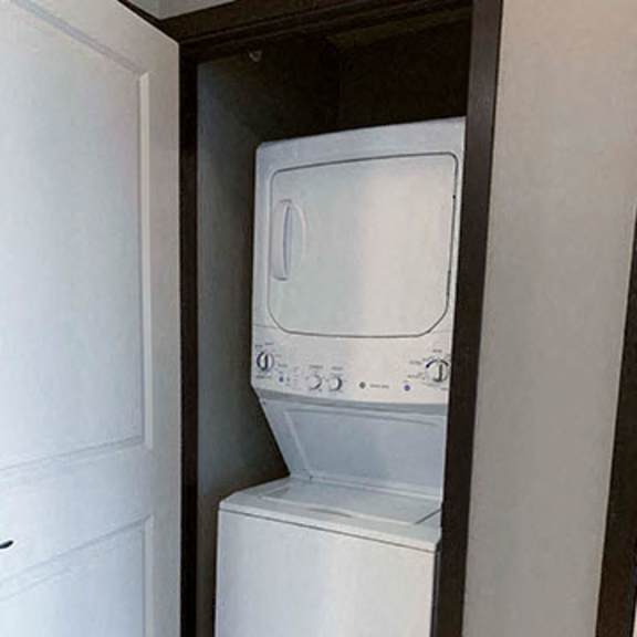 Thumbnail 14 of 21 Full-size stacked washer and dryer included in in a 1 bedroom apartment for rent at The Flats at 84 apartments Lincoln NE 68516