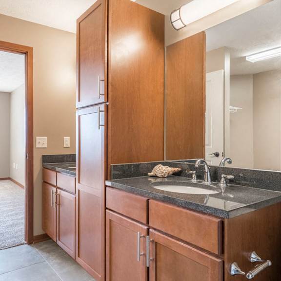 Thumbnail 10 of 24 Bathroom granite countertops at The Flats at 84 in southeast Lincoln NE 68516