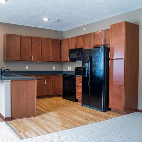 Thumbnail 4 of 13 U-shaped kitchen with black appliances