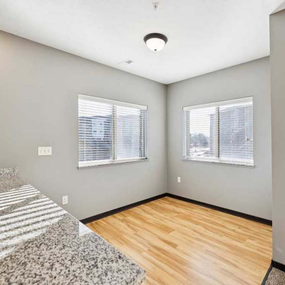 Thumbnail 6 of 23 A dining room with wooden flooring.
