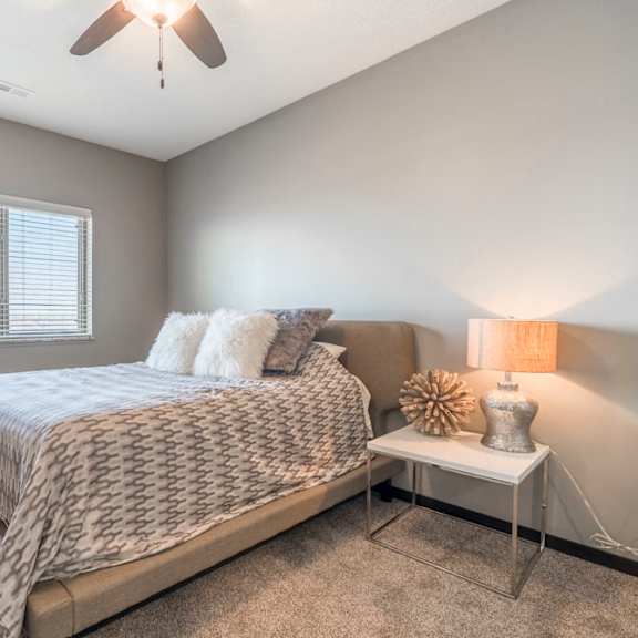 Thumbnail 8 of 12 Living room with ceiling fan at The Flats at 84 in southeast Lincoln NE 68516