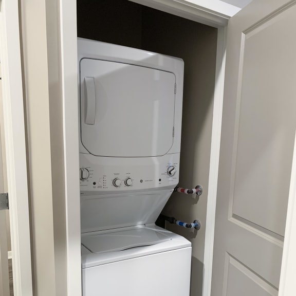 Thumbnail 13 of 16 Stacked washer and dryer included in the plum studio apartment