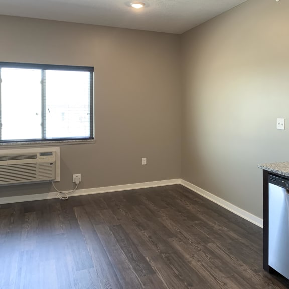 Thumbnail 5 of 16 Kitchen space leading to the living and dining space