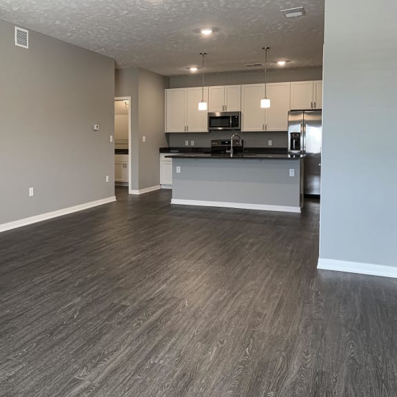 Thumbnail 17 of 20 Living and dining area leading into the kitchen in the buffalo floorplan at the flats at shadow creek