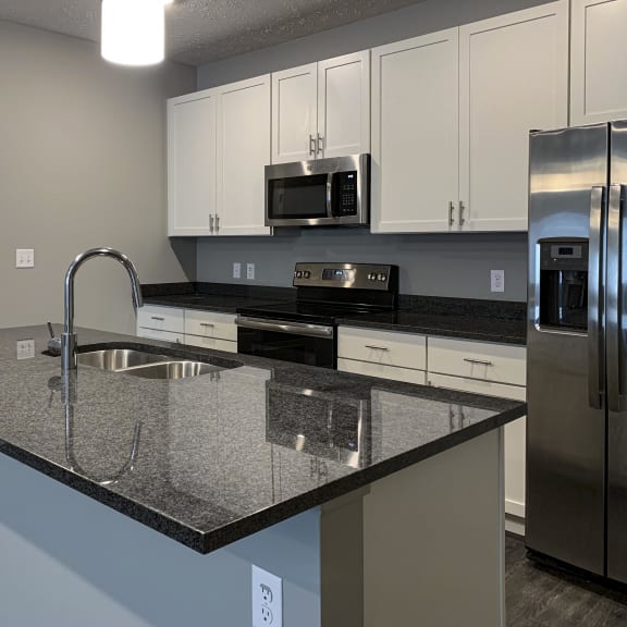Thumbnail 7 of 20 Large kitchen island with granite countertops and sink
