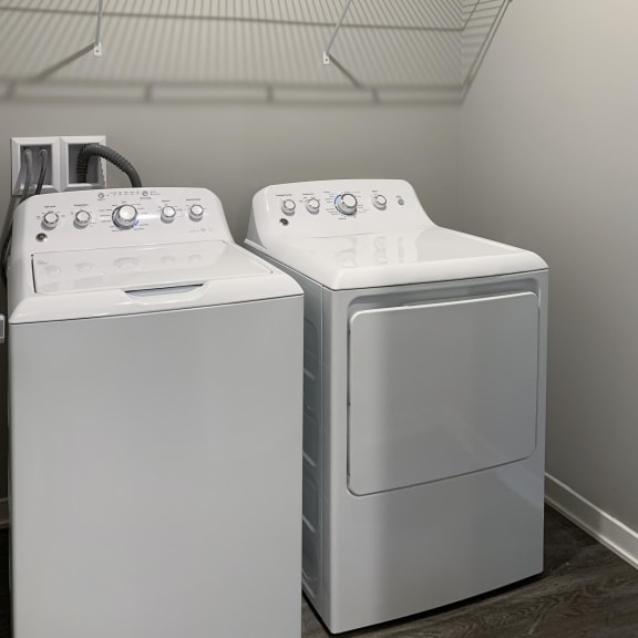 Thumbnail 20 of 23 Washer and dryer closet with shelving space The Flats at Shadow Creek in Lincoln Nebraska