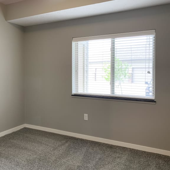 Thumbnail 19 of 23 Large carpeted bedroom with window The Flats at Shadow Creek in Lincoln Nebraska