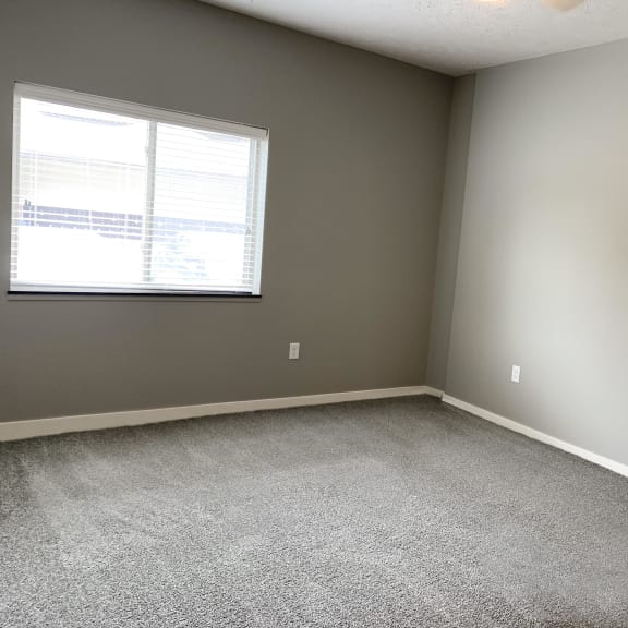 Thumbnail 10 of 23 Large carpeted bedroom with window The Flats at Shadow Creek in Lincoln Nebraska