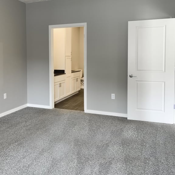 Thumbnail 9 of 23 master bedroom with access to walk in closet and private bathroom The Flats at Shadow Creek in Lincoln Nebraska