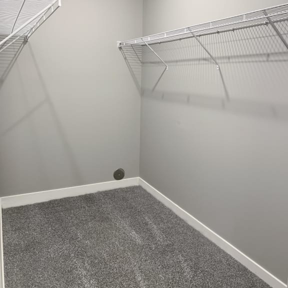Thumbnail 11 of 23 large spacious walk in closet with shelving and hanging space at The Flats at Shadow Creek