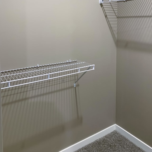 Thumbnail 13 of 15 Walk in closet with plenty of shelving and hanging space