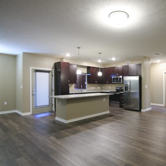 Thumbnail 2 of 15 Large living and dining area with hardwood floors