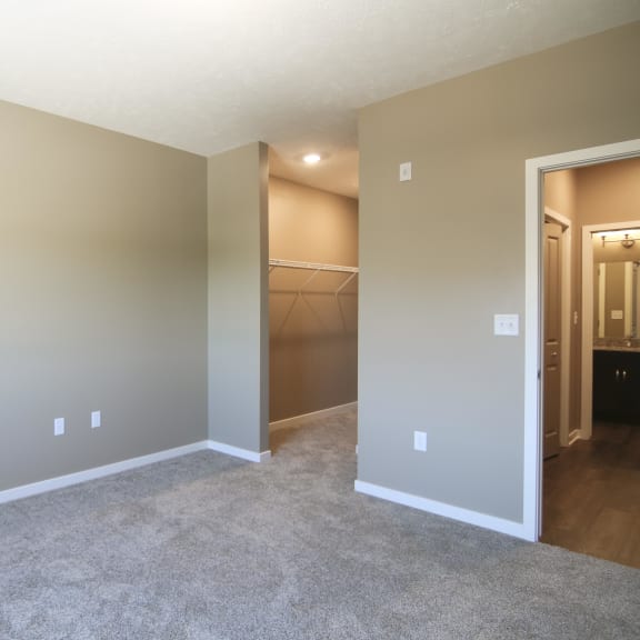 Thumbnail 12 of 15 Carpeted bedroom with walk in closet