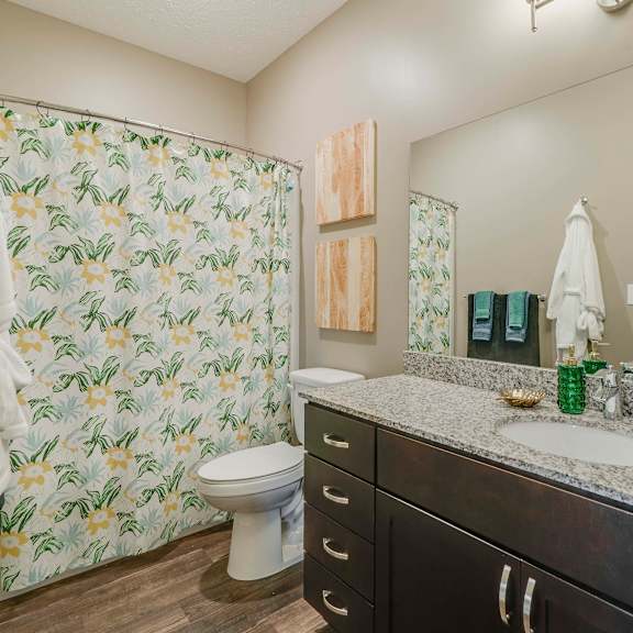 Thumbnail 13 of 15 Large bathroom with granite countertop at The Flats at Shadow Creek new luxury apartments in east Lincoln NE 68520