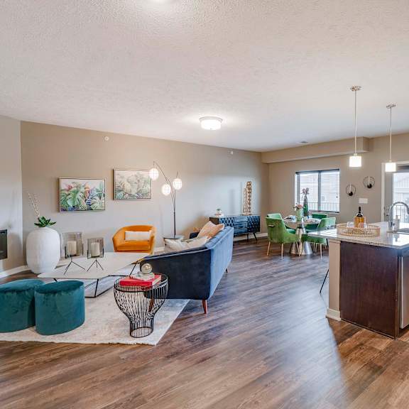 Thumbnail 2 of 15 Open floor plan with modern fireplace at The Flats at Shadow Creek new luxury apartments in east Lincoln NE 68520