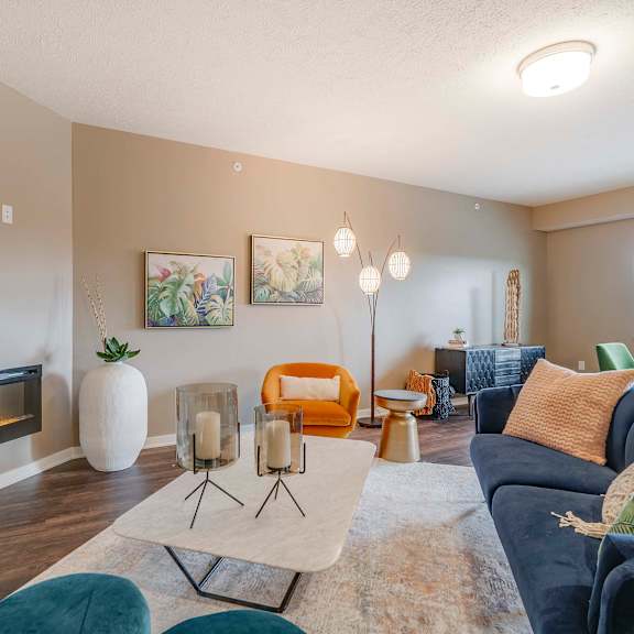 Thumbnail 8 of 15 Spacious living room with modern fireplace at The Flats at Shadow Creek new luxury apartments in east Lincoln NE 68520