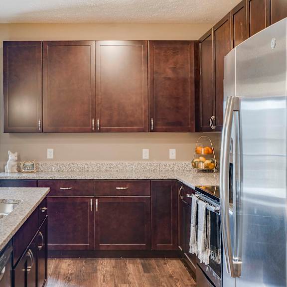 Thumbnail 5 of 15 Spacious kitchens with granite countertops at The Flats at Shadow Creek new luxury apartments in east Lincoln NE 68520