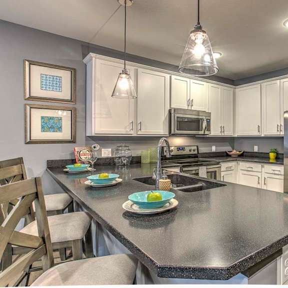 Thumbnail 19 of 23 Counter top seating and view of the kitchen at The Helen
