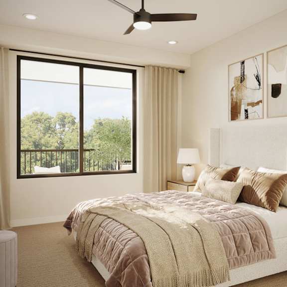 Thumbnail 2 of 2 Rendering of bright townhome apartment bedroom with upholstered bed, neutral finishes, ceiling fan, and large window with balcony and tree views.