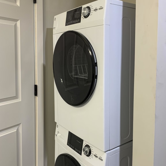 Thumbnail 16 of 24 a front load washer and dryer in a laundry room