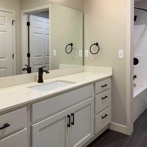 Thumbnail 27 of 29 bathroom with a white sink, tub, shower, and toilet.