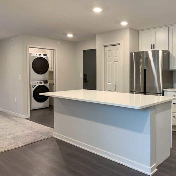 Thumbnail 4 of 29 modern kitchen with stainless steel appliances and white cabinets.