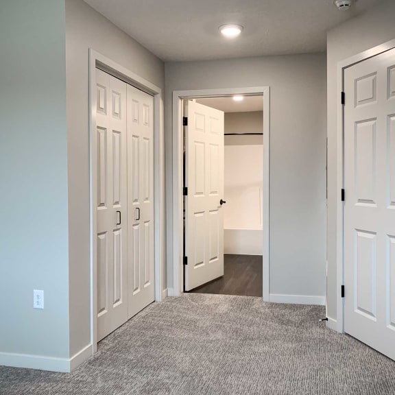 Thumbnail 22 of 24 a bedroom with closet and attached bathroom
