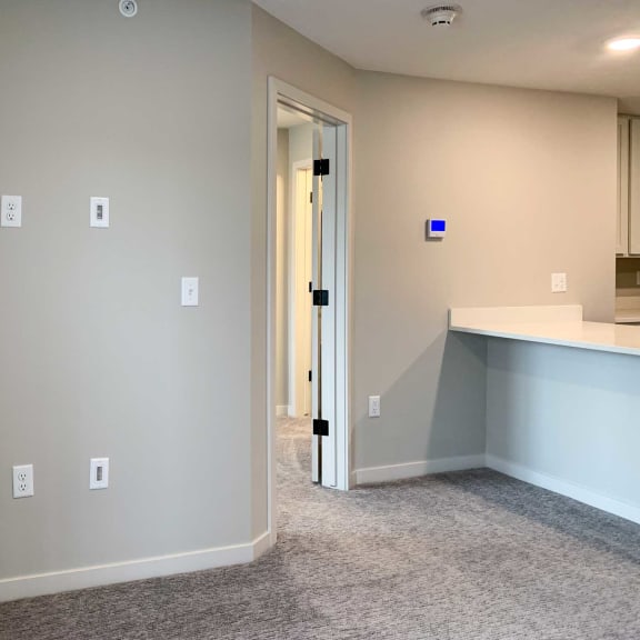 Thumbnail 23 of 24 a living room with outlets and hdmi connectors