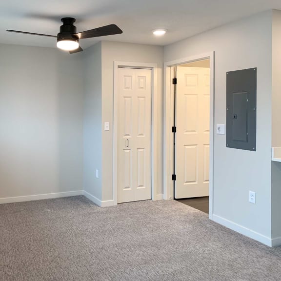 Thumbnail 8 of 15 a room with a ceiling fan and a closet