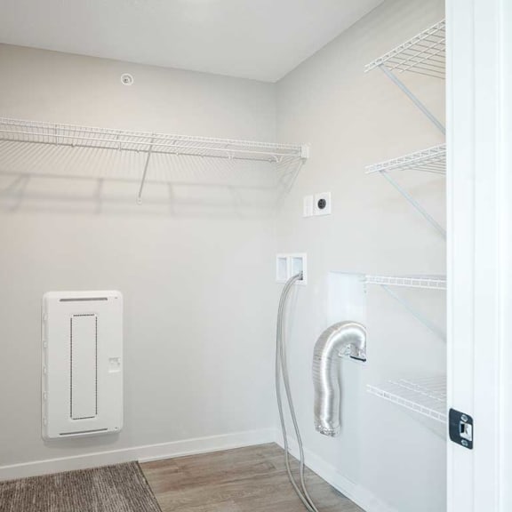 Thumbnail 16 of 19 A large walk-in closet with built-in shelving and hanging space