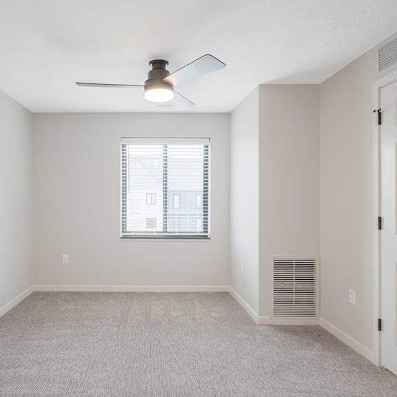Thumbnail 30 of 30 The primary bedroom in the Dove featuring a window and ceiling fan
