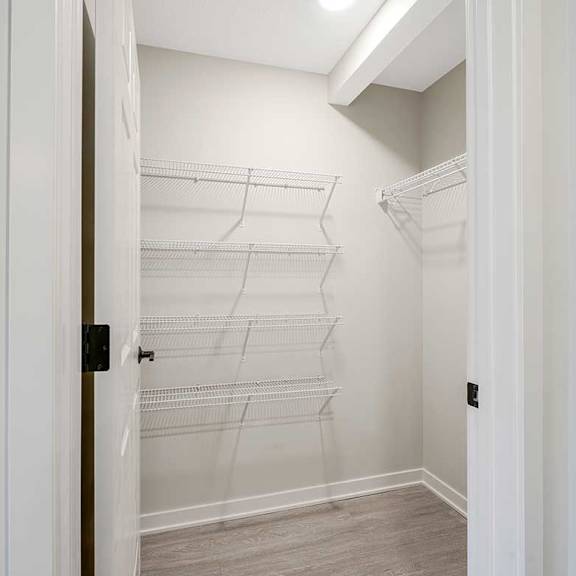 Thumbnail 7 of 30 A walk-in kitchen pantry featuring built-in shelving
