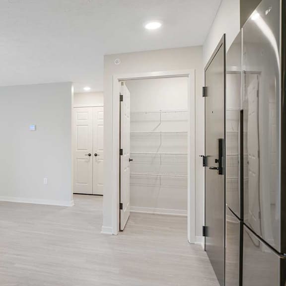 Thumbnail 6 of 30 A walk-in kitchen pantry featuring built-in shelving