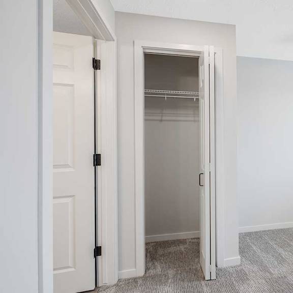 Thumbnail 14 of 25 a closet in the main room next to the bathroom door