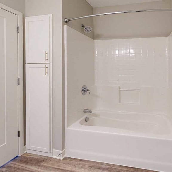 Thumbnail 29 of 29 A bathroom with a tub shower.