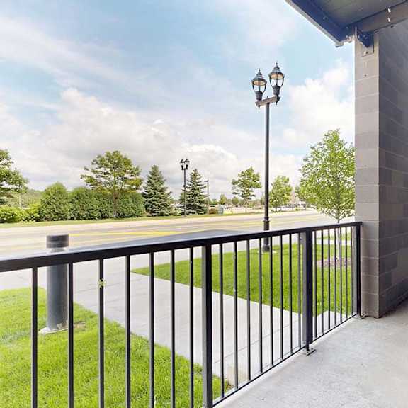 Thumbnail 9 of 31 Porch with black metal railing