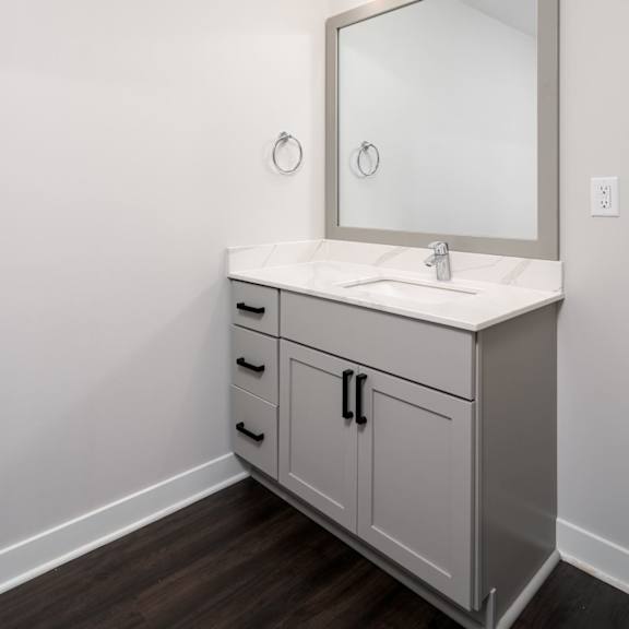 Thumbnail 5 of 15 bathroom vanity and sink with large mirror above and towel ring on the left