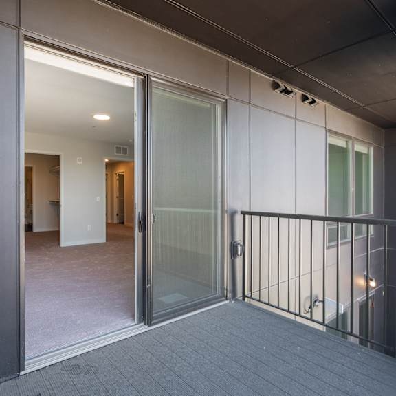 Thumbnail 8 of 15 large balcony with sliding screen and glass door