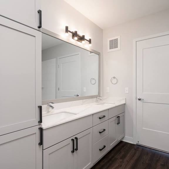 Thumbnail 11 of 15 large white double vanity with large mirror and tall storage cabinet on the right