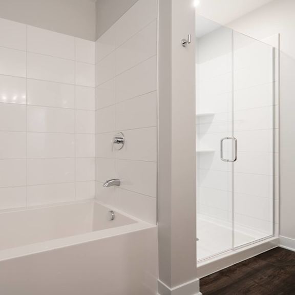 Thumbnail 12 of 15 Bathroom with bath tub and walk in glass shower to the right