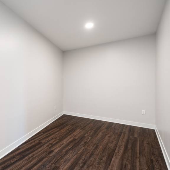 Thumbnail 13 of 15 perfect size den with white walls and dark brown hard wood flooring