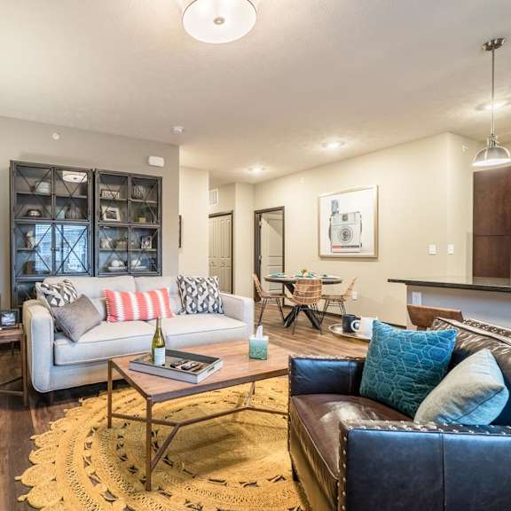 a modern living room with a fireplace and a large tv mounted on the wall.