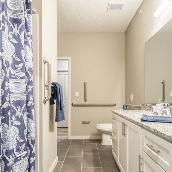 Thumbnail 13 of 14 Primary bedroom with large vanity and shower