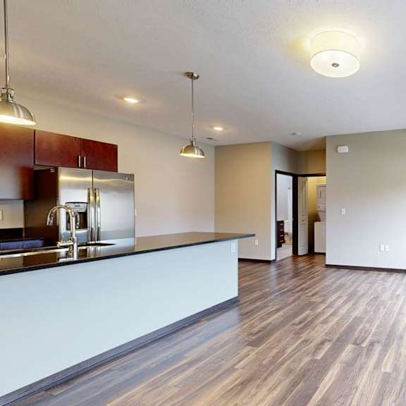 Thumbnail 3 of 9 Open living room and kitchen with large windows