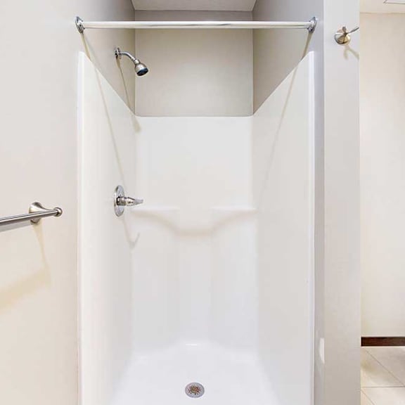 Thumbnail 24 of 24 A bathroom with a walk-in shower.